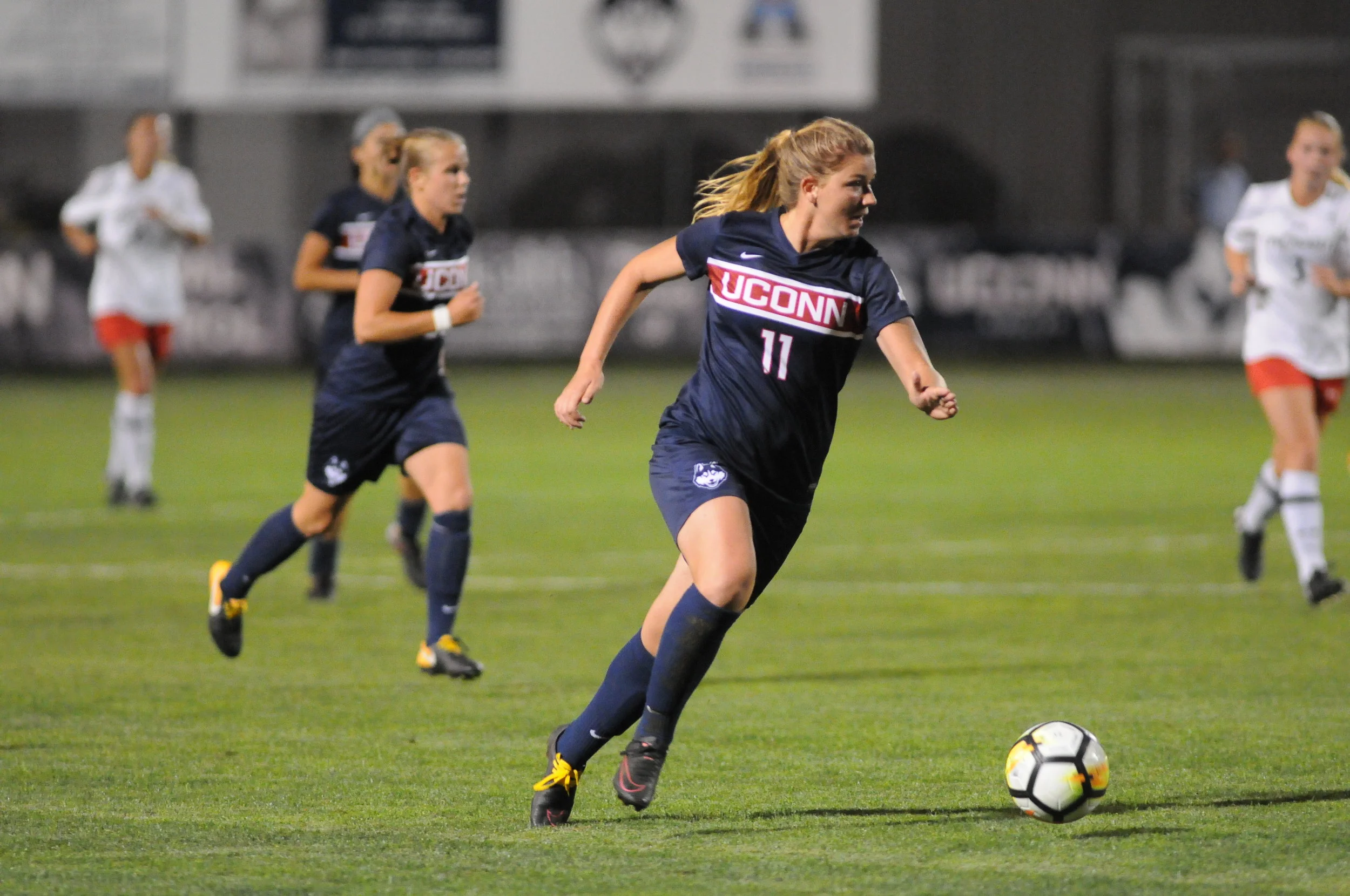 Kim Urbanek (11) charges down the field in the UConn Women's Soccer game against Providence on Sept 28, 2017. (Mark Wezenski/The Daily Campus)