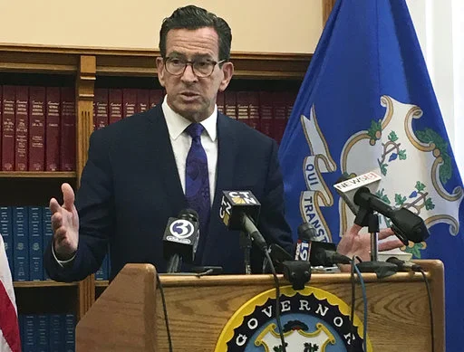 Connecticut Gov. Dannel P. Malloy speaks after top state legislative leaders said they had reached an agreement on a tentative framework for a new two-year budget, Wednesday, Oct. 18, 2017, at the Capitol in Hartford, Conn. (AP Photo/Susan Haigh)