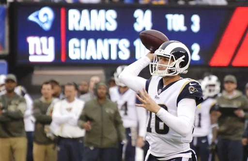 Los Angeles Rams quarterback Jared Goff (16) throws a pass to Robert Woods for a touchdown during the second half of an NFL football game against the New York Giants, Sunday, Nov. 5, 2017, in East Rutherford, N.J. (AP Photo/Bill Kostroun)