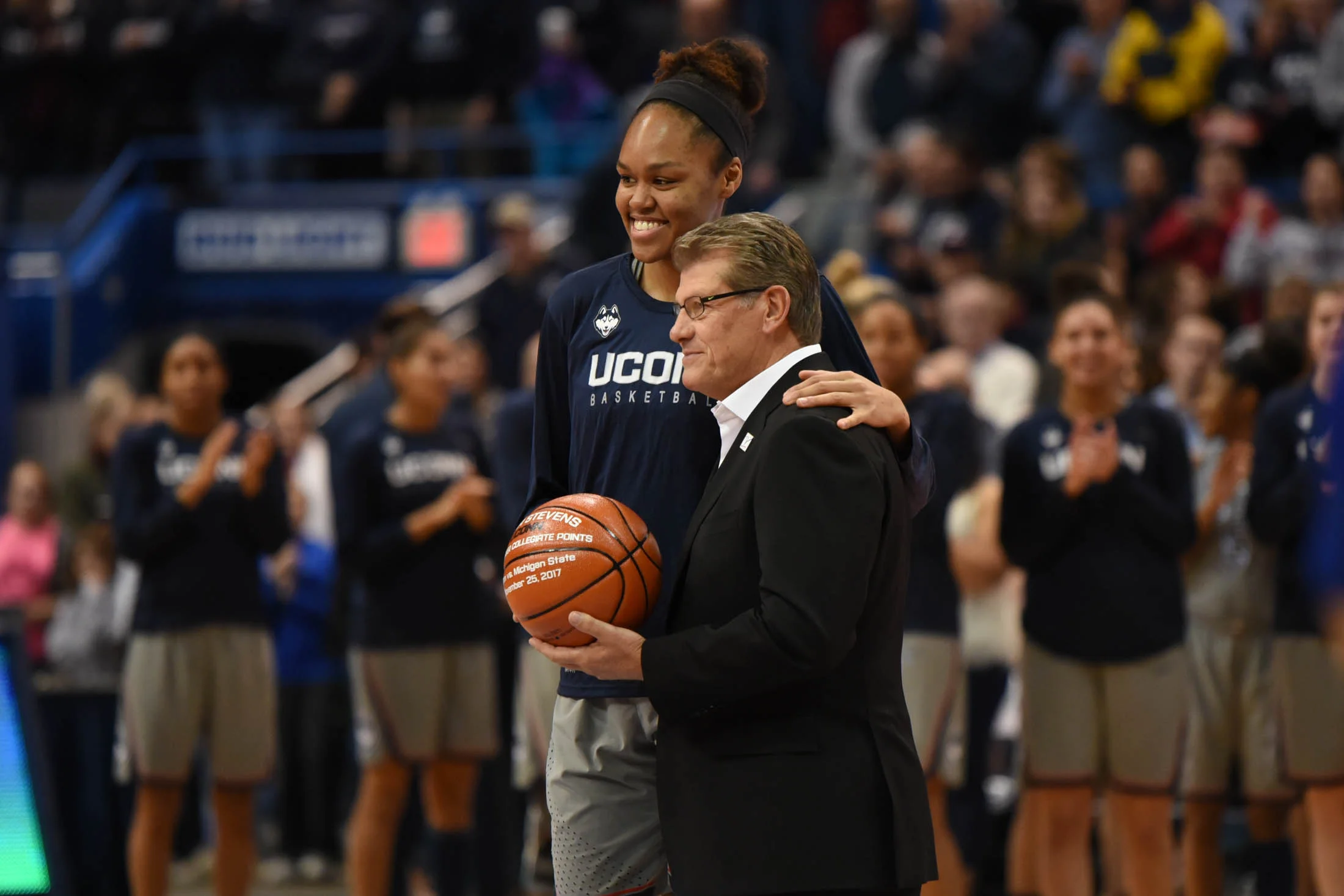 Azura Stevens is awarded for her 1,000 point achievement from playing at Duke and UConn. (Charlotte Lao/The Daily Campus)