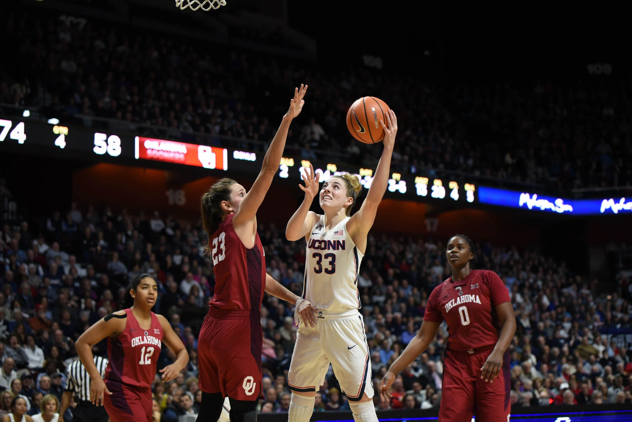 Katie Lou Samuelson goes up for a shot against a defender. Samuelson finishes the game with 19 points to help the Huskies defeat the Sooners 88-64. (Charlotte Lao/The Daily Campus)