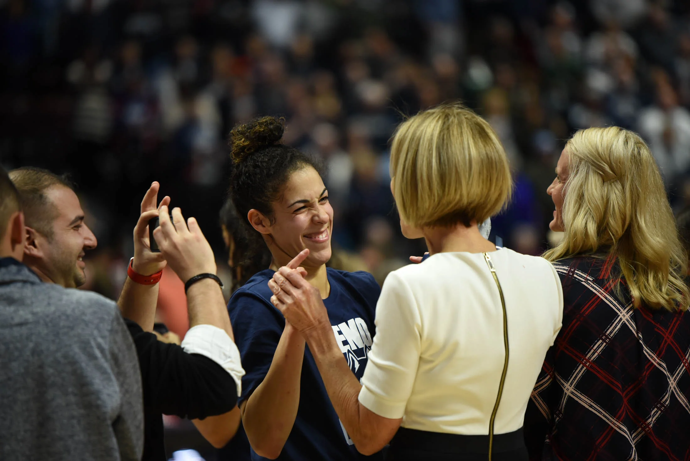 Kia Nurse congratulates Chris Dailey on her accomplishment. (Charlotte Lao/The Daily Campus) 
