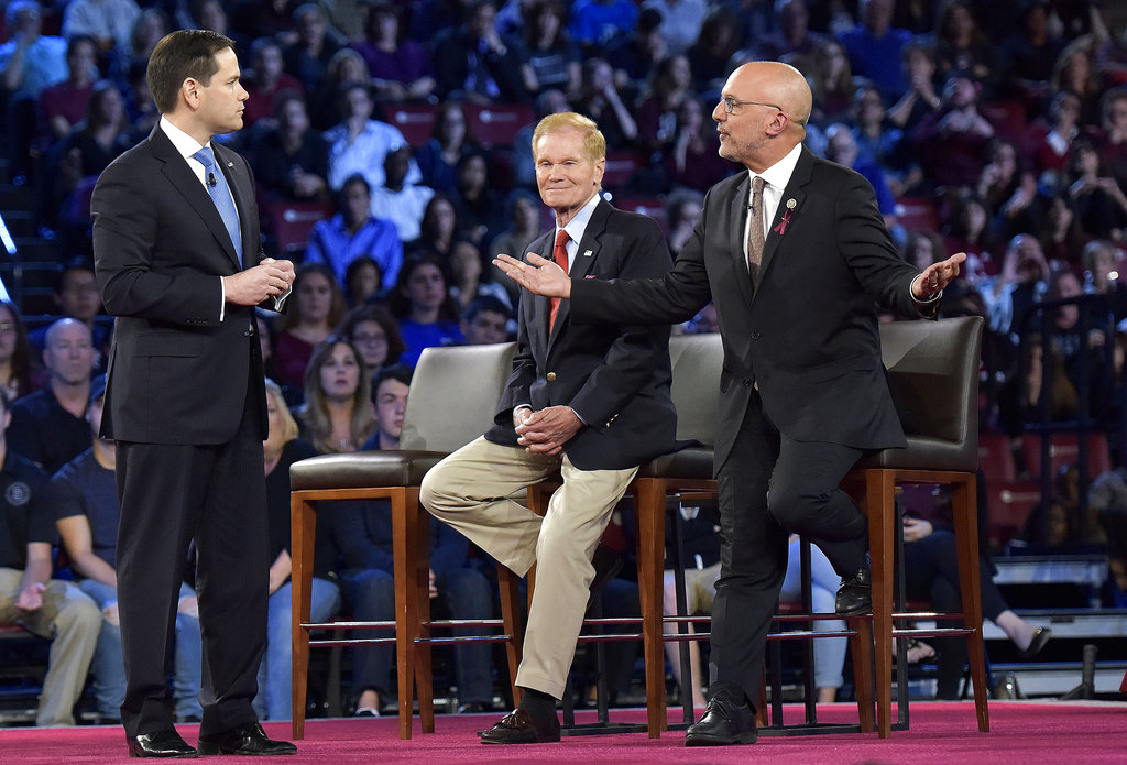 Democratic Rep. Ted Deutch of Florida, right, disagrees with Sen. Marco Rubio during a CNN town hall meeting, Wednesday, Feb. 21, 2018, at the BB&T Center, in Sunrise, Fla. (Michael Laughlin/South Florida Sun-Sentinel via AP)