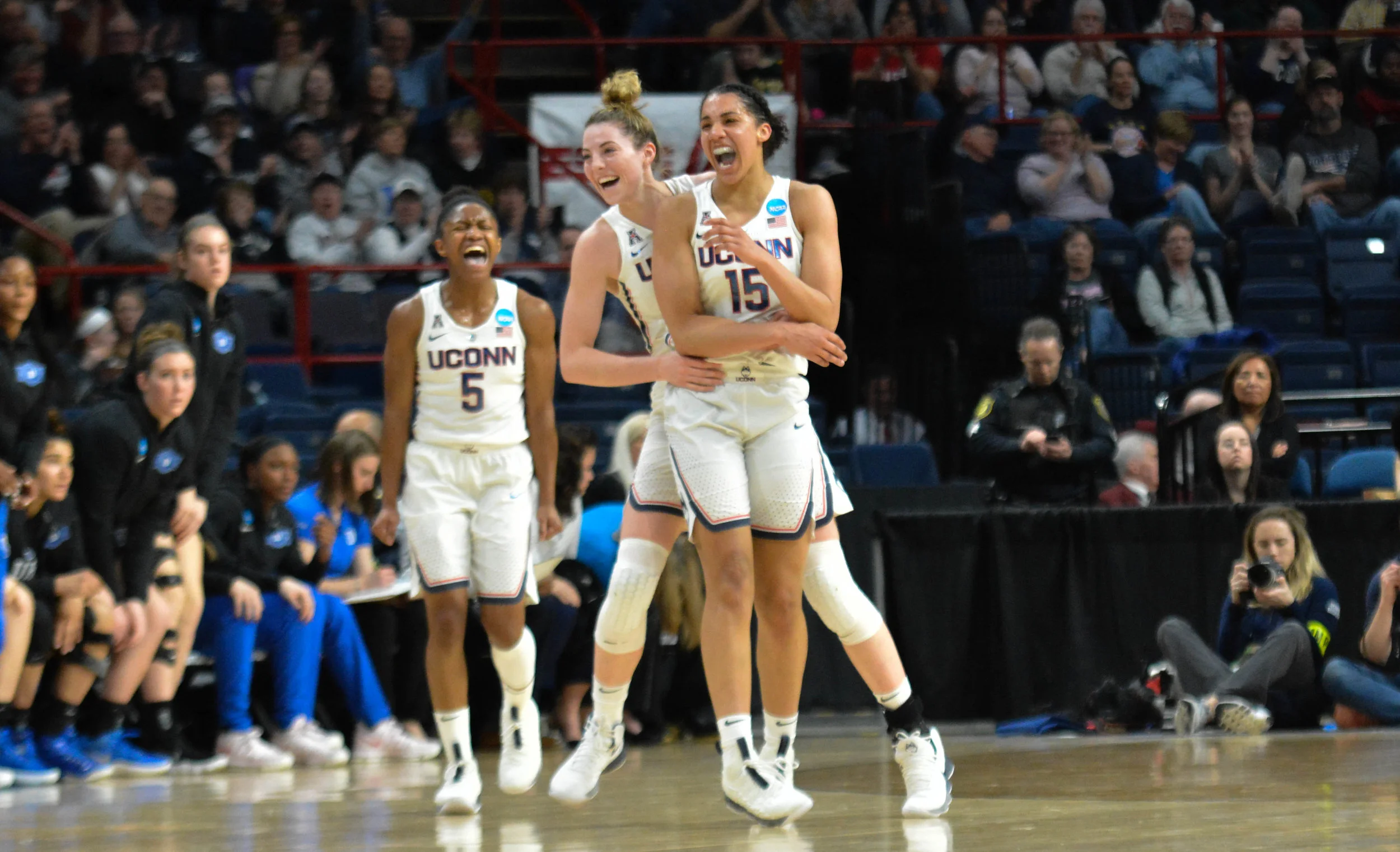 UConn forward Gabby Williams (15) celebrates with Katie Lou Samuelson hugging her following a halftime buzzer-beating shot in the Huskies' 72-59 win over the Duke Blue Devils in a Sweet 16 matchup Saturday at the Times Union Center in Albany, New York.. (Photo by Jon Sammis, Senior Staff Photographer/The Daily Campus)