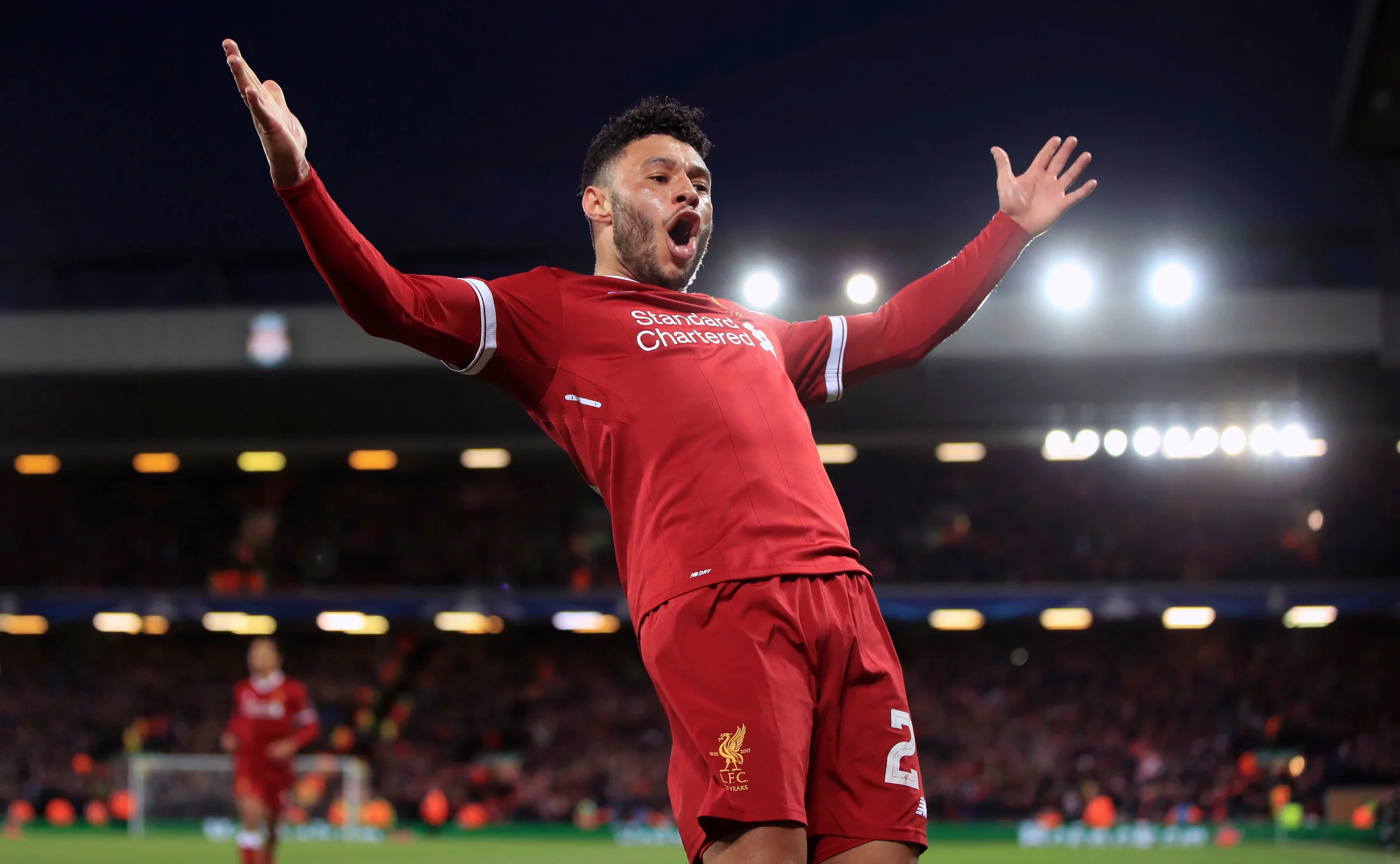 Liverpool's Alex Oxlade-Chamberlain celebrates after scoring his side's second goal of the game during the Champions League quarter final, first leg soccer match between Liverpool and Manchester City at Anfield, Liverpool, England, Wednesday, April 4, 2018. (Peter Byrne/PA via AP)