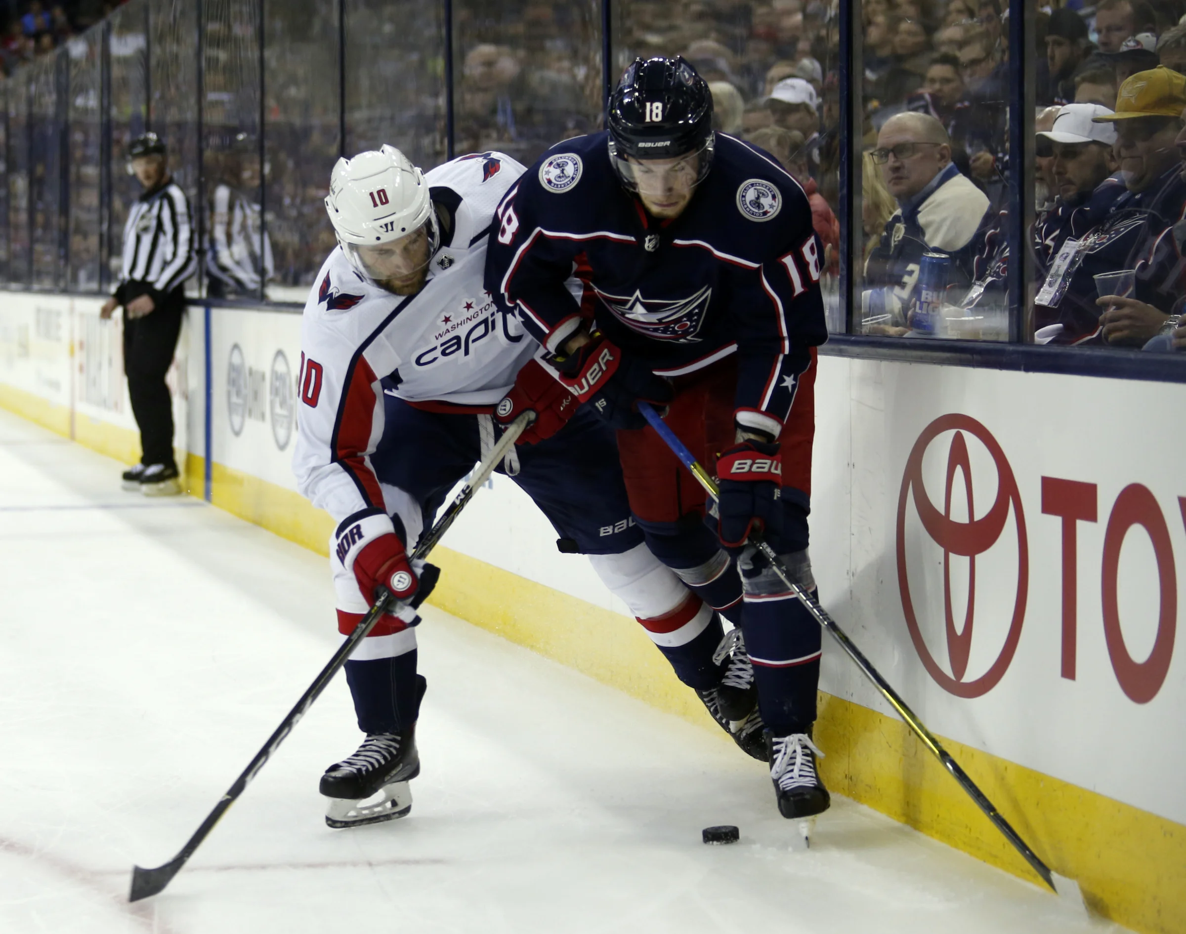 Columbus Blue Jackets forward Pierre-Luc Dubois, right, works against Washington Capitals forward Brett Connolly during the second period in Game 3 of an NHL first-round hockey playoff series in Columbus, Ohio, Tuesday, April 17, 2018. (AP Photo/Paul Vernon)