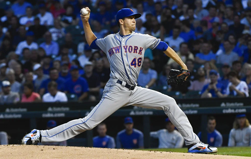 New York Mets starting pitcher Jacob deGrom (48) delivers during the first inning of a baseball game against the Chicago Cubs on Tuesday, Aug. 28, 2018, in Chicago. (AP Photo/Matt Marton)