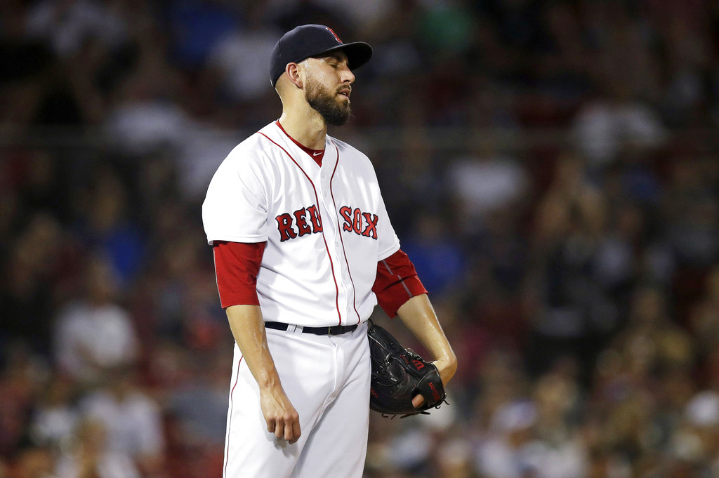 Boston Red Sox relief pitcher Matt Barnes reacts after giving up a home run to Miami Marlins' Starlin Castro, which tied the game at 4-4, during the eighth inning of a baseball game at Fenway Park in Boston, Tuesday, Aug. 28, 2018. (AP Photo/Charles Krupa)