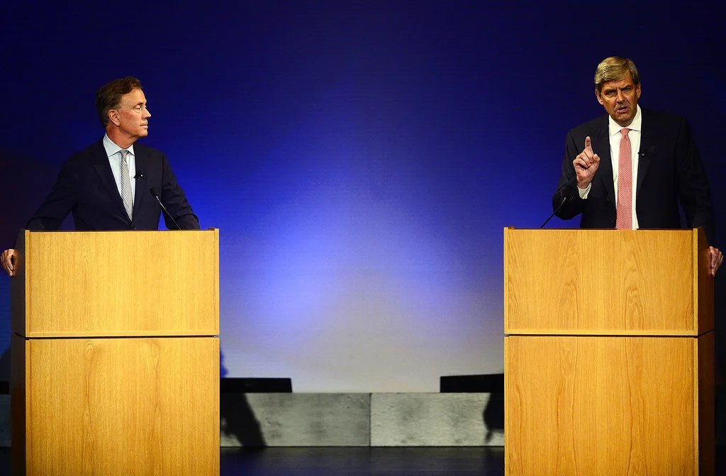 Democrat Ned Lamont, left, looks on as Republican Bob Stefanowski speaks in the first gubernatorial debate of the campaign between the two candidates the Garde Arts Center on Wednesday, Sept. 12, 2018, in New London, Conn. (Sarah Gordon/The Day via AP)