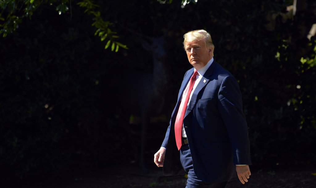 FILE- In this Oct. 4, 2018, file photo President Donald Trump walks from the Oval Office to the Marine One on the South Lawn of the White House in Washington for the short trip to Andrews Air Force Base where he will travel to Minnesota. Big real estate developers like Donald Trump have long benefited from a myriad of legal loopholes and breaks that can shrink their tax bills. Expanding their advantages, the federal tax overhaul that took effect this year handed real estate interests some additional benefits. (AP Photo/Susan Walsh, File)