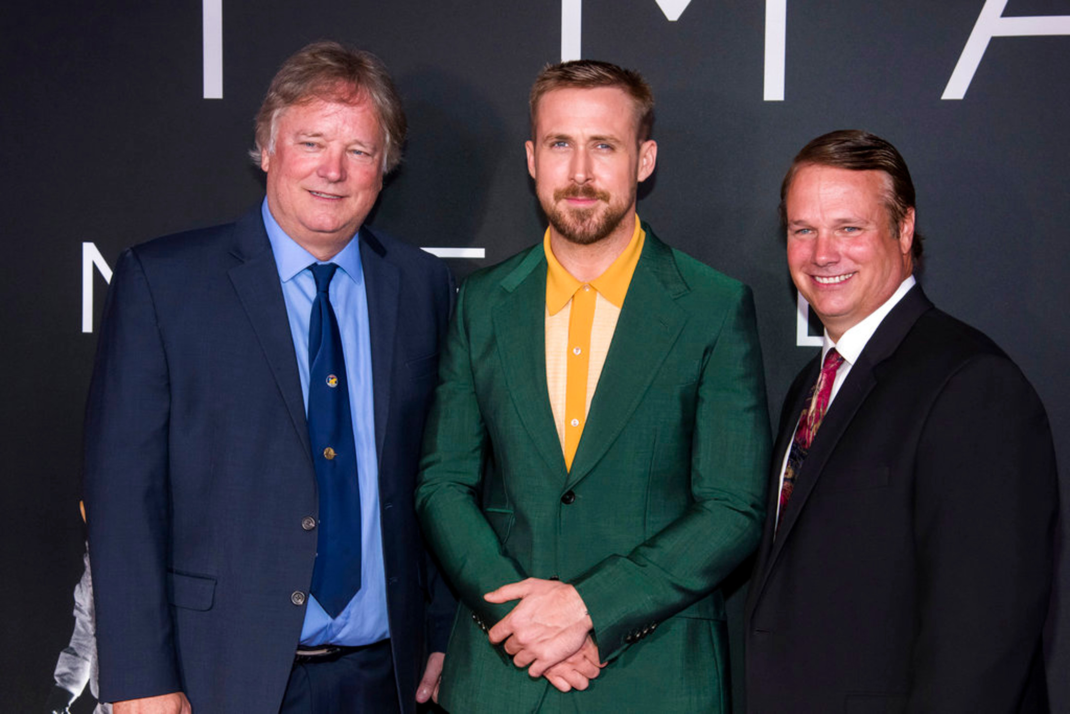 Rick Armstrong, left, Ryan Gosling and Mark Armstrong attend the "First Man" premiere at the National Air and Space Museum of the Smithsonian Institution on Thursday, Oct. 4, 2018, in Washington. (Photo by Charles Sykes/Invision/AP)