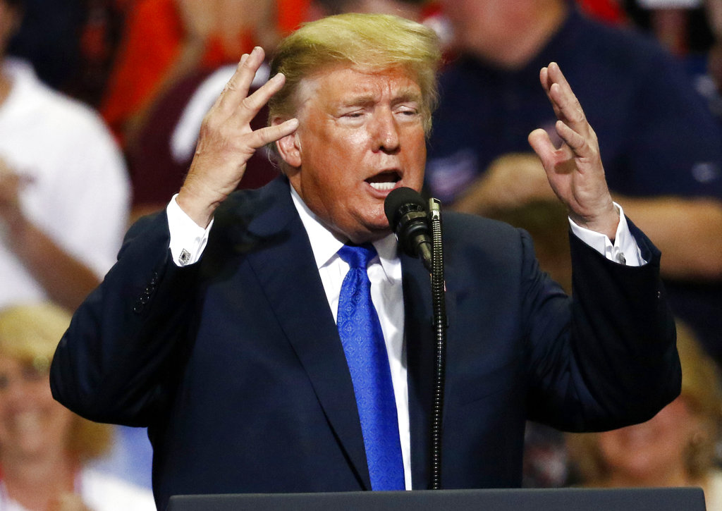 In this Oct. 2, 2018 photo, President Donald Trump gestures as he speaks at a rally in Southaven, Miss. President Trump misrepresented the testimony of his Supreme Court nominee’s chief accuser on a rally stage over the past week as campaign politics and the pitched struggle over Brett Kavanaugh’s fate. (AP Photo/Rogelio V. Solis)
