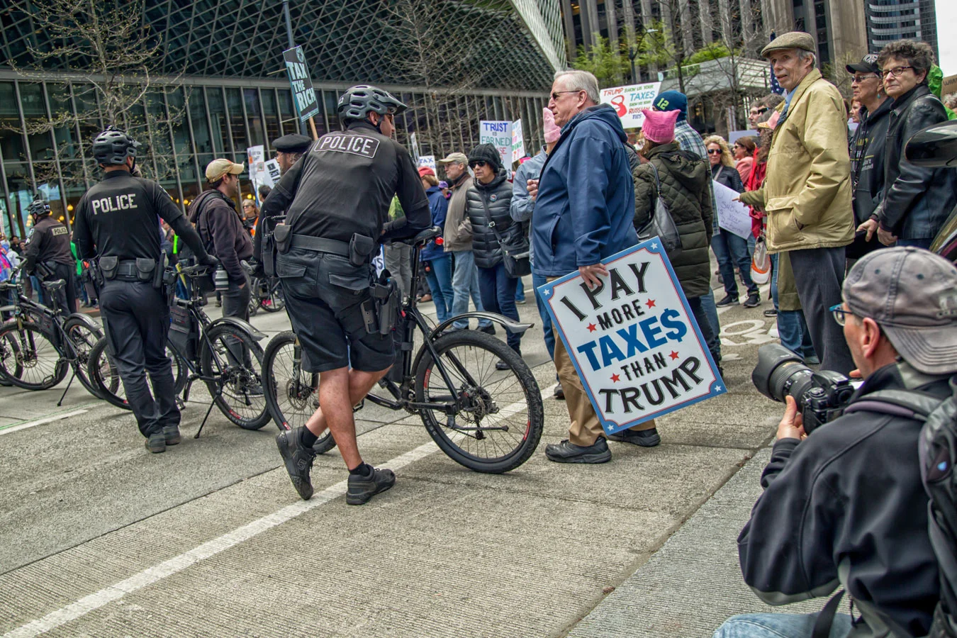 Police supervise a protest against tax cuts for the wealthy on Monday, April 16. (Photo courtesy of Flickr Creative Commons)