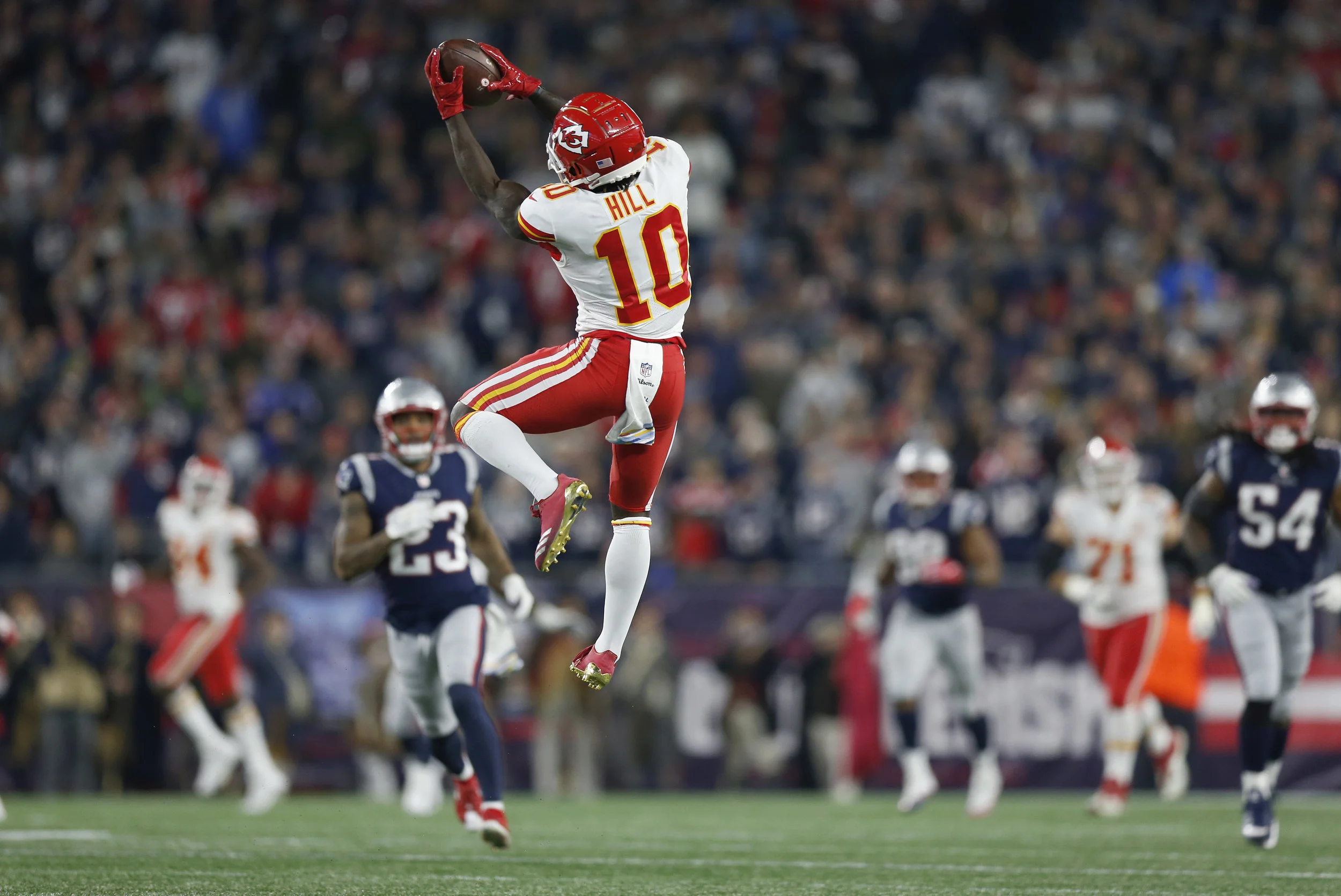 Tyreek Hill catches a pass that he ran in for a touchdown during the second half against the New England Patriots, Sunday, Oct. 14, 2018, in Foxborough, Mass. (AP Photo/Michael Dwyer)