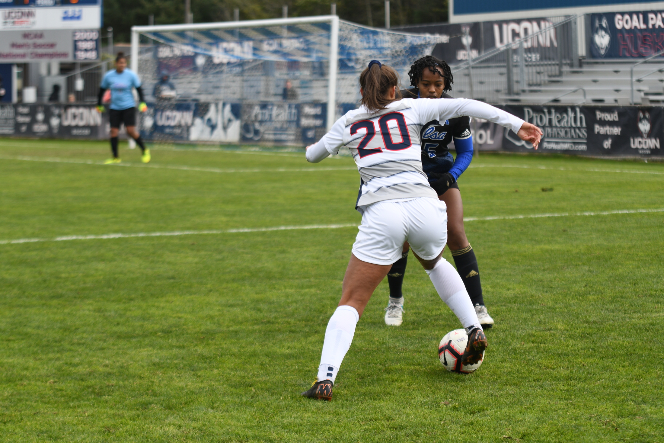 Senior forward Elena Santos attacks a Tulsa defender on Senior Day (Eric Wang/The Daily Campus)