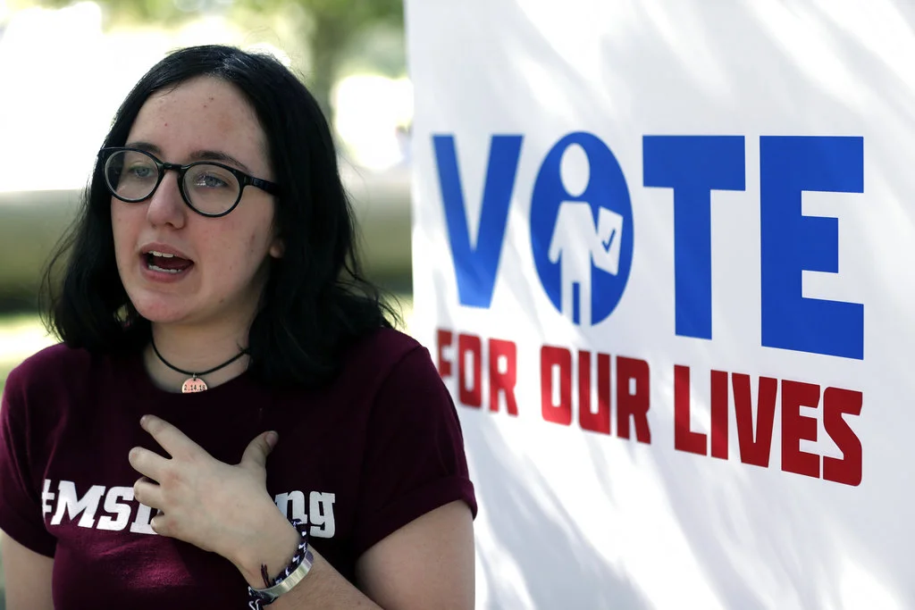 In this Wednesday, Oct. 31, 2018 photo, Sofie Whitney, activist and student at Marjory Stoneman Douglas High School in Parkland, Florida, talks about voting during a Vote for Our Lives event at the University of Central Florida in Orlando, Fla. Nine months after 17 classmates and teachers were gunned down at their Florida school, Parkland students are finally facing the moment they’ve been leading up to with marches, school walkouts and voter-registration events throughout the country: their first Election Day. (AP Photo/John Raoux)