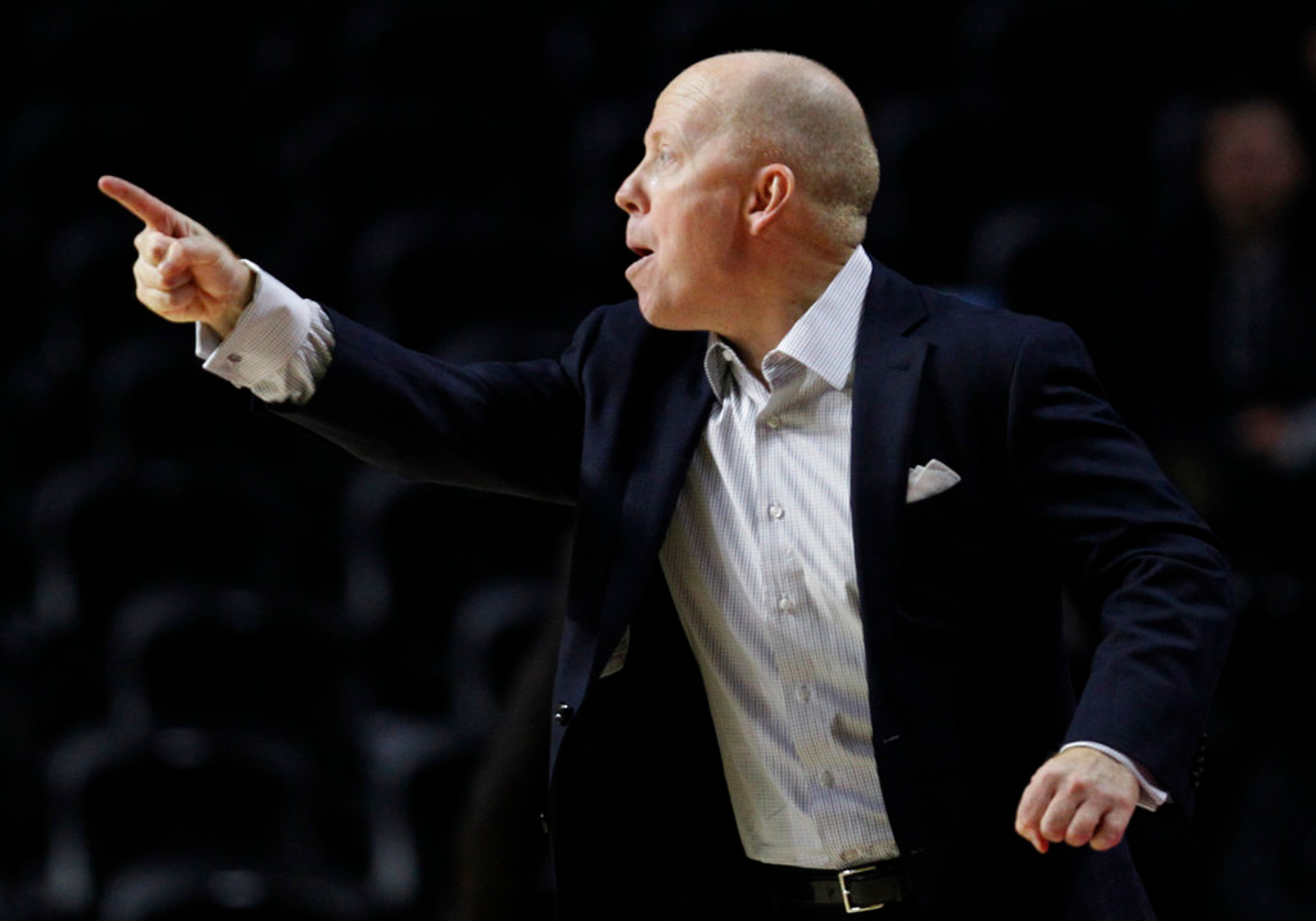 FILE - In this Jan. 4, 2018, file photo, Cincinnati head coach Mike Cronin shouts from the sideline during the first half of an NCAA college basketball game against Temple, in Philadelphia. The Bearcats had a resurgent season while playing away from home while their arena was refurbished, winning the American Athletic championship before losing in the second round of the NCAA Tournament. They’re looking to build upon that success as they move back into their on-campus arena this season. (AP Photo/Laurence Kesterson, File)
