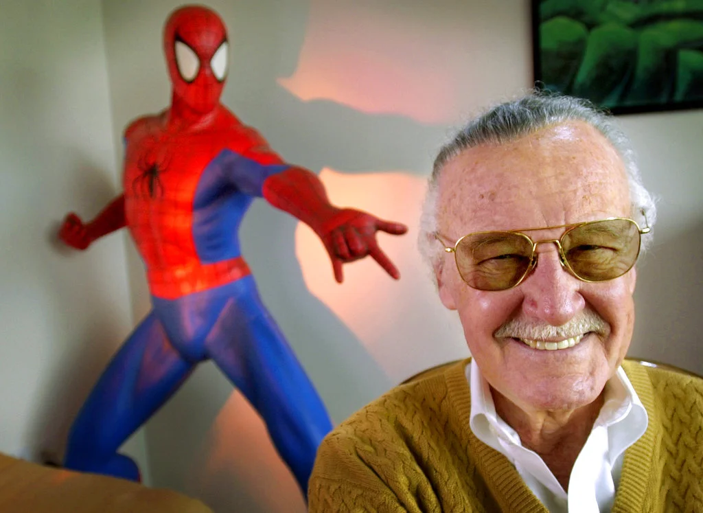 FILE - In this April 16, 2002, file photo, Stan Lee, 79, creator of comic-book franchises such as "Spider-Man," "The Incredible Hulk" and "X-Men," smiles during a photo session in his office in Santa Monica, Calif. Comic book genius Lee, the architect of the contemporary comic book, has died. He was 95. (AP Photo/Reed Saxon, File)
