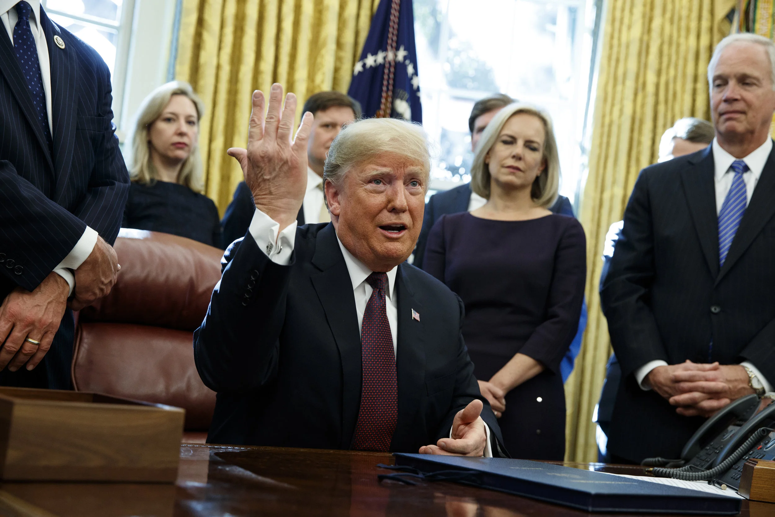 President Donald Trump answers a reporters question about the investigation of special counsel Robert Mueller in the Oval Office of the White House, Friday, Nov. 16, 2018, in Washington. (AP Photo/Evan Vucci)