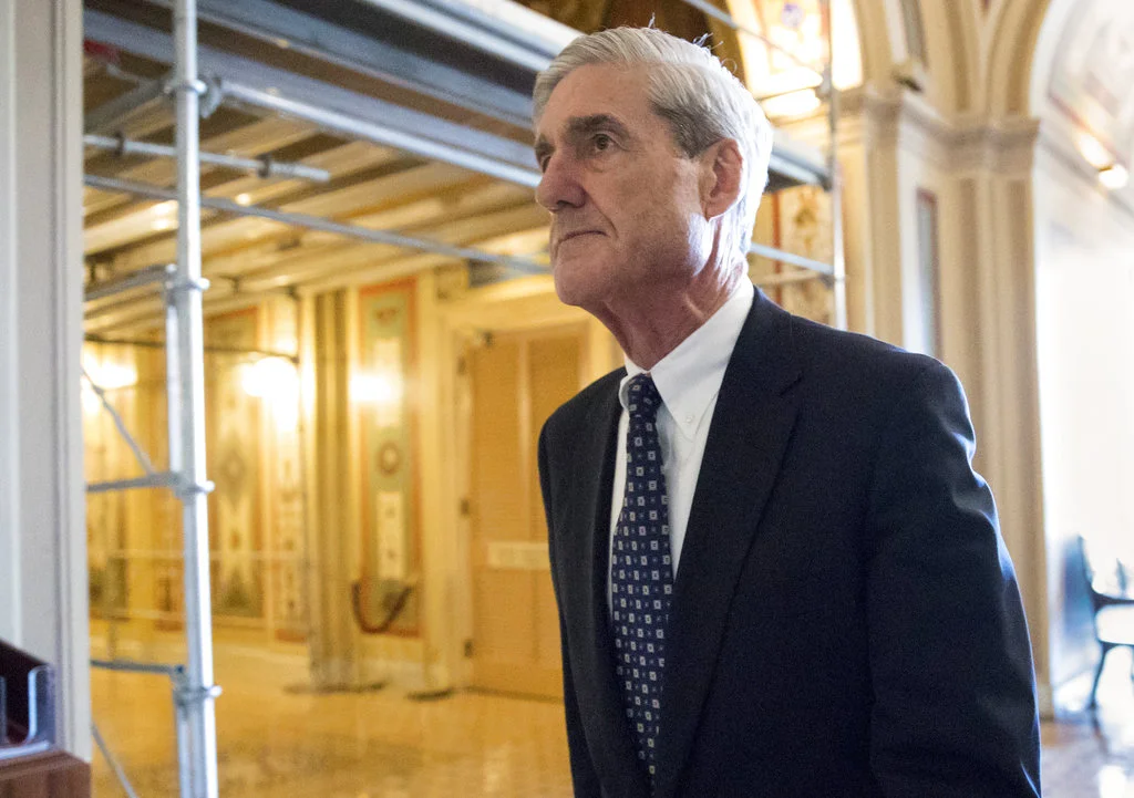 FILE - In this June 21, 2017, file photo, special counsel Robert Mueller departs after a meeting on Capitol Hill in Washington. Mueller is back. After a quiet few months in the run-up to the midterm elections, the special counsel’s Russia investigation is heating up again with a string of tantalizing new details emerging this week.(AP Photo/J. Scott Applewhite, File)