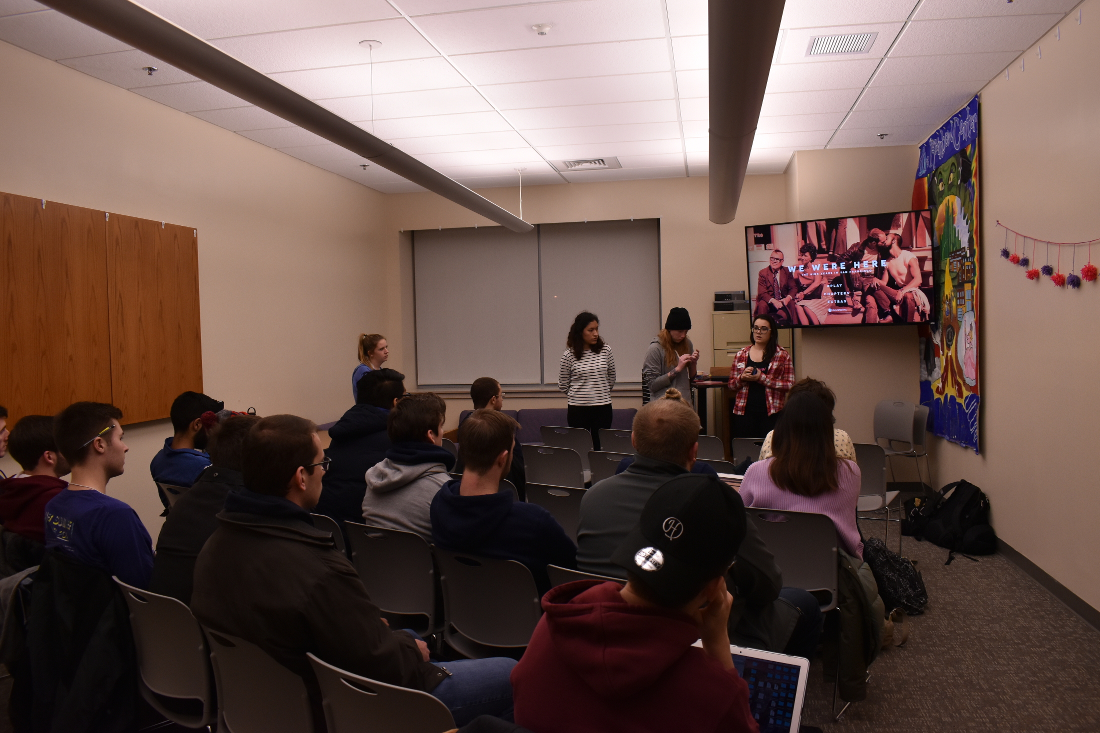 Students watch a documentary about the AIDS epidemic that was heavily prevalent in the 80s. Afterwards, they wrote possible solutions towards ending the AIDS epidemic on paper hearts (Brandon Barzola/The Daily Campus.