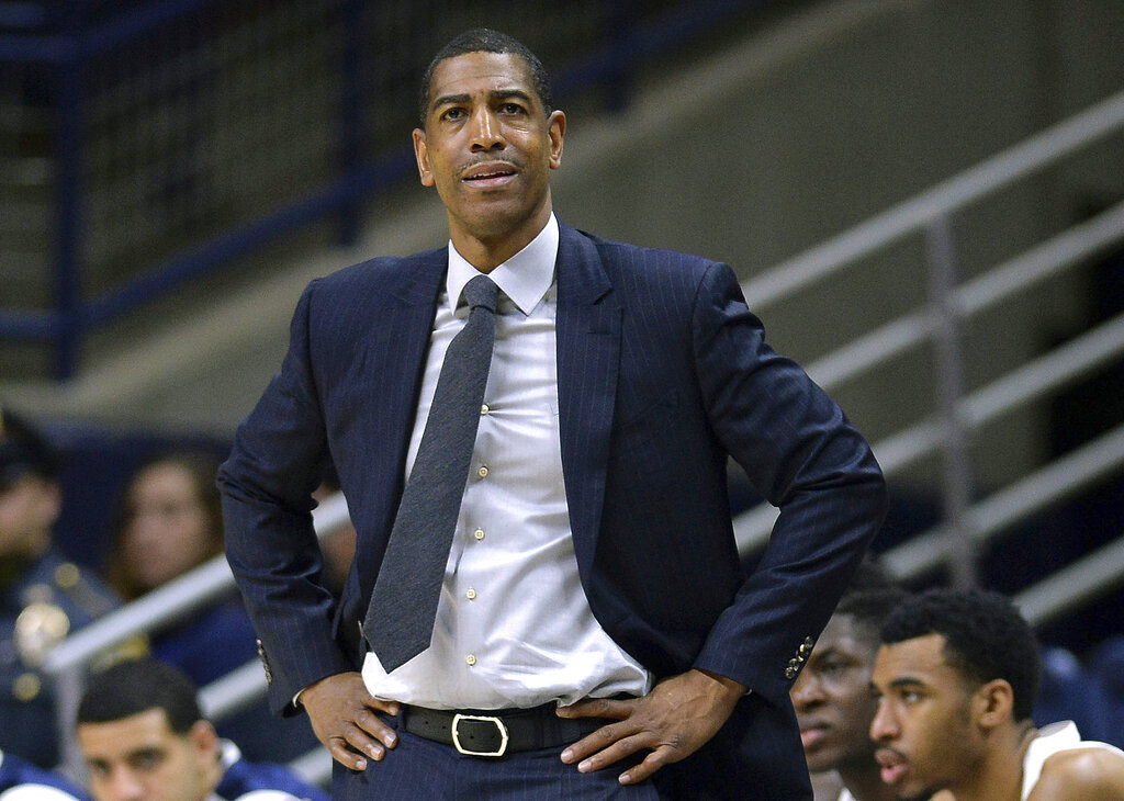 FILE - In this Feb. 7, 2018, file photo, Connecticut head coach Kevin Ollie watches from the sideline during the first half an NCAA college basketball game in Storrs, Conn. A federal judge dismissed a complaint on Tuesday, Feb. 5, 2019, filed by Ollie connected to his allegations that his firing was in part racially motivated, deciding the complaint was filed prematurely. The judge did not rule on the merits of the request. (AP Photo/Jessica Hill, File)