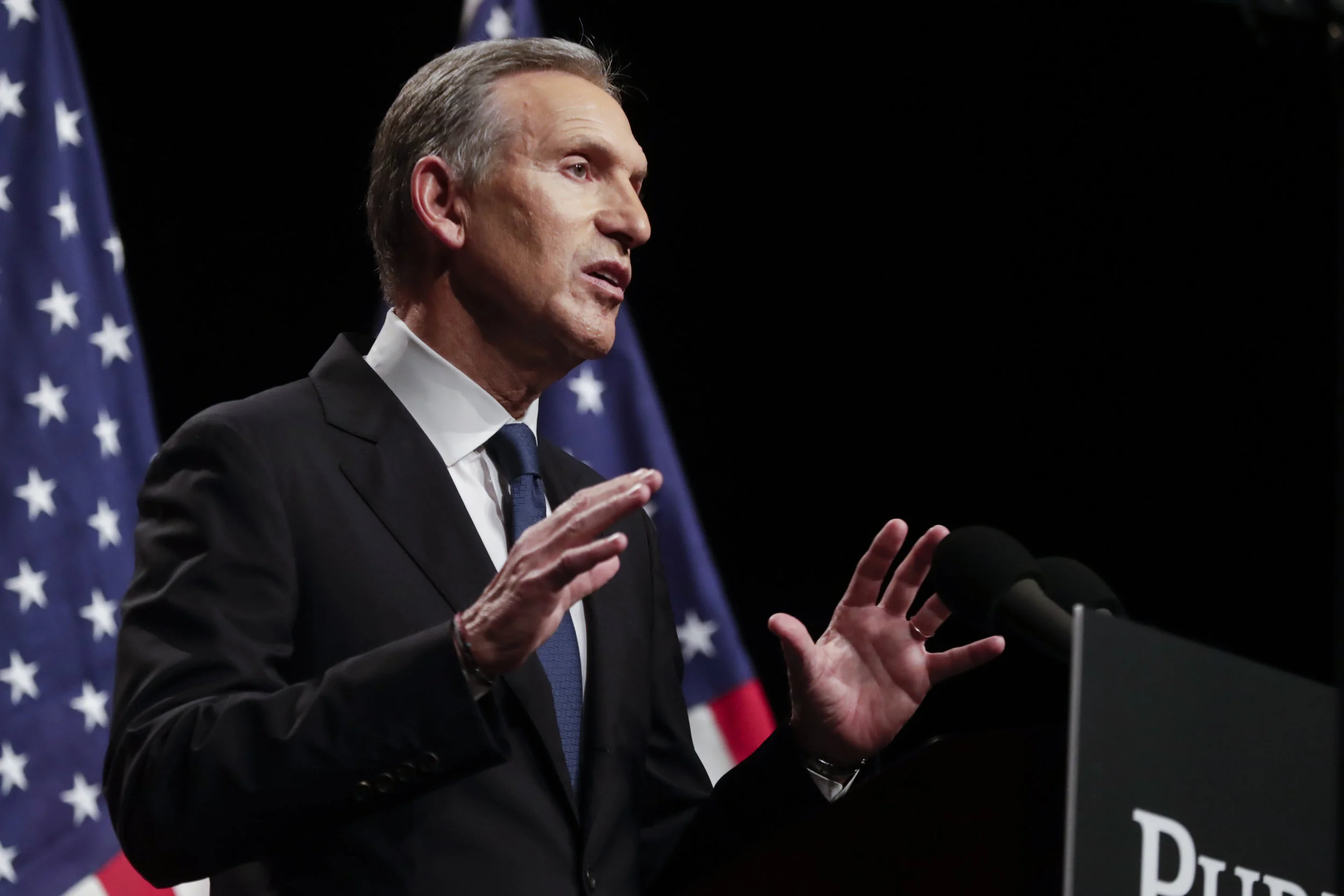 In this Feb. 7, 2019 file photo, former Starbucks CEO Howard Schultz speaks at Purdue University in West Lafayette, Ind. Schultz has acknowledged the manager of one of the company’s shops in Philadelphia where two black men were arrested last year might not have called authorities if the two men had been white. The acknowledgement came Wednesday night, Feb. 13 at an event in the city where Schultz was confronted by the person who first shared the video of two black men getting arrested at the shop. (AP Photo/Michael Conroy, File)