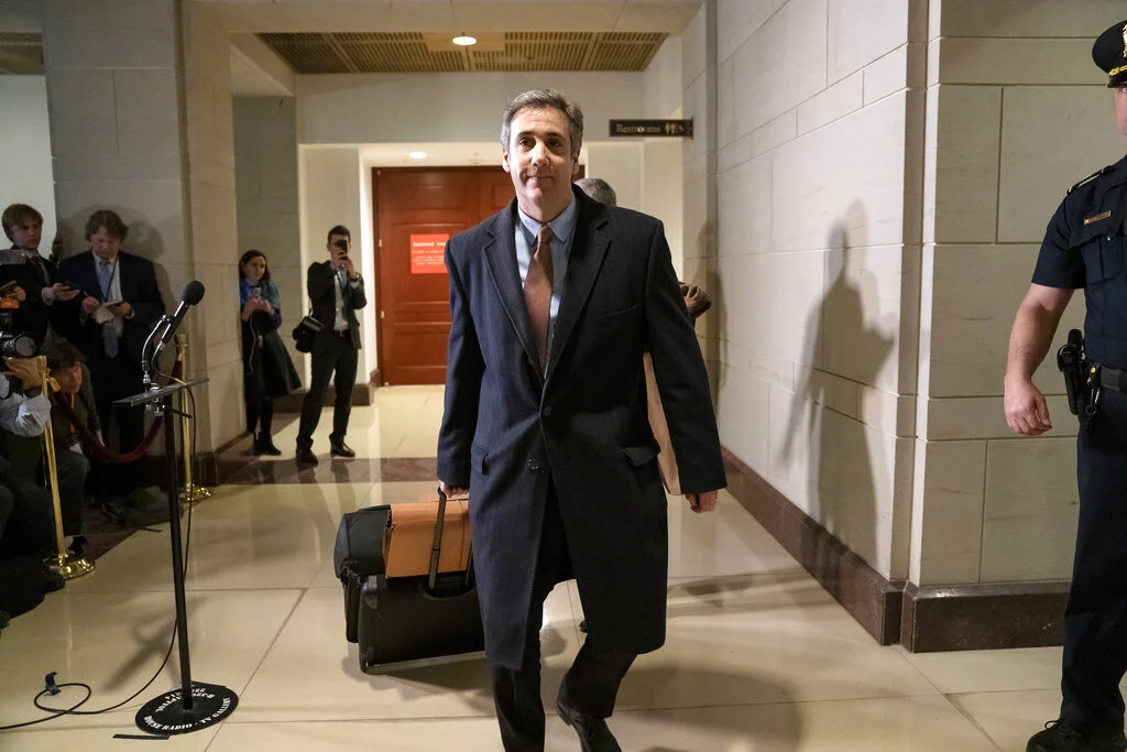 Michael Cohen, President Donald Trump's former lawyer, tells reporters he will "continue to cooperate" with investigators departing after a full day of testimony with the House Intelligence Committee behind closed doors as he prepares for a three-year prison sentence for lying to Congress and other charges, at the Capitol in Washington, Wednesday, March 6, 2019. (AP Photo/J. Scott Applewhite)