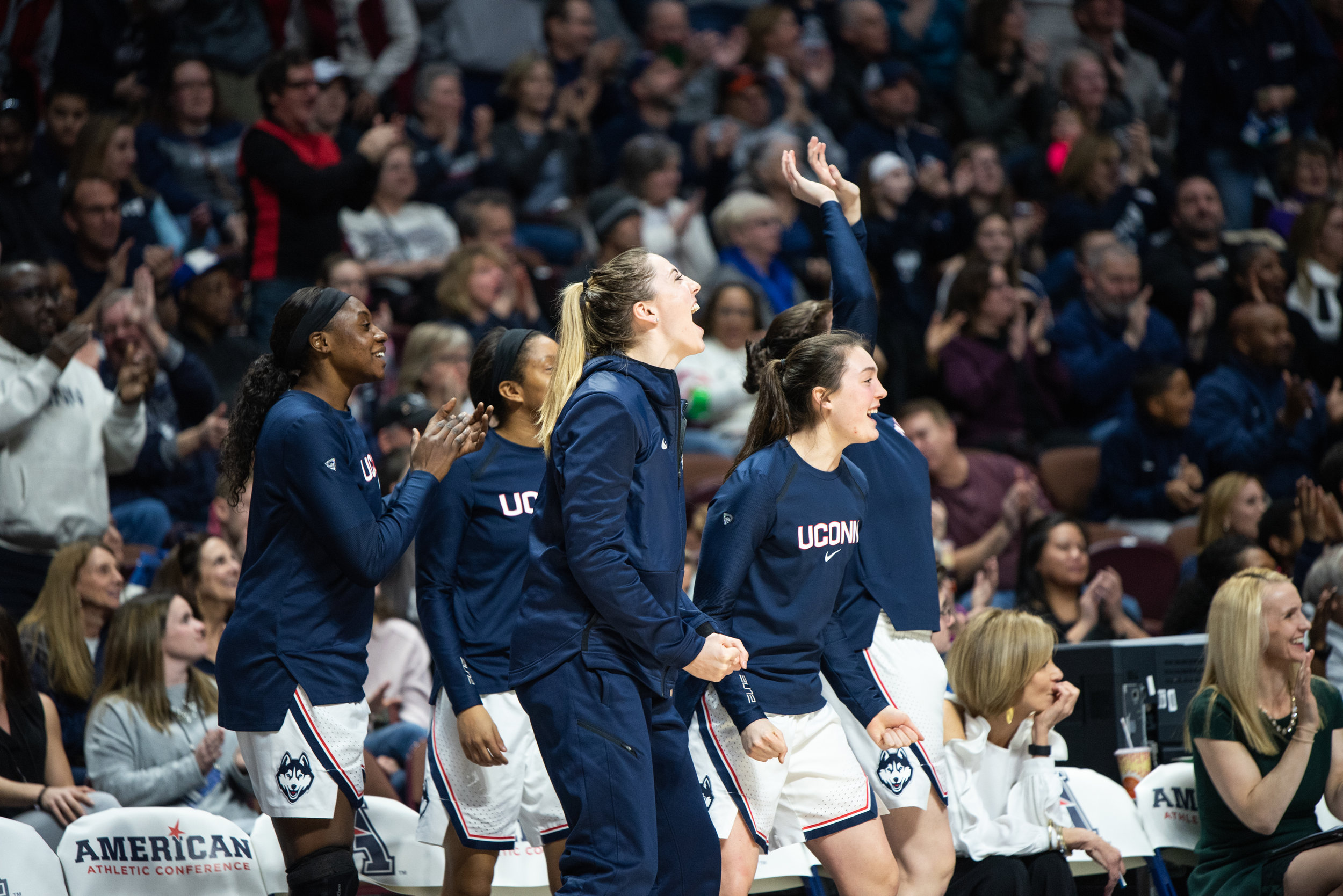 The Huskies’ bench celebrates as the team moves on to yet another American Conference Championship. (Charlotte Lao/The Daily Campus)