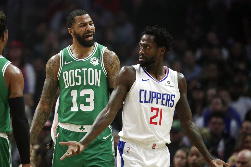 Los Angeles Clippers' Patrick Beverley, right, argues with Boston Celtics' Marcus Morris during the first half of an NBA basketball game, Monday, March 11, 2019, in Los Angeles. (AP Photo/Jae C. Hong)
