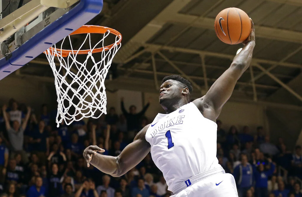 FILE - In this Jan. 5, 2019, file photo, Duke's Zion Williamson (1) dunks during the second half of an NCAA college basketball game against Clemson, in Durham, N.C. Williamson was named both The Associated Press ACC player and newcomer of the year, Tuesday, March 12, 2019. (AP Photo/Gerry Broome, File)