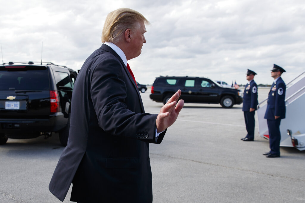 President Donald Trump walks to board Air Force One after speaking to the media, Sunday, March 24, 2019, at Palm Beach International Airport, in West Palm Beach, Fla., en route to Washington. (AP Photo/Carolyn Kaster)