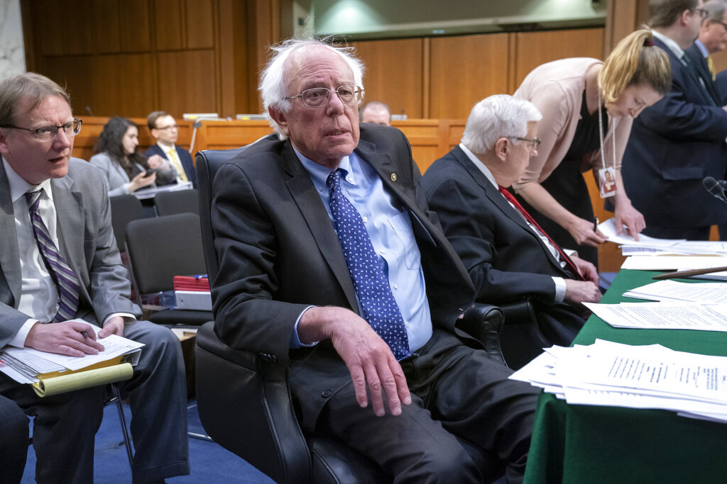 Sen. Bernie Sanders, I-Vt., the top Democrat on the Senate Budget Committee, joined at right by Sen. Mike Enzi, R-Wyo., the chairman, vote on amendments for the fiscal year 2020 budget resolution, on Capitol Hill in Washington, Thursday, March 28, 2019. (AP Photo/J. Scott Applewhite)