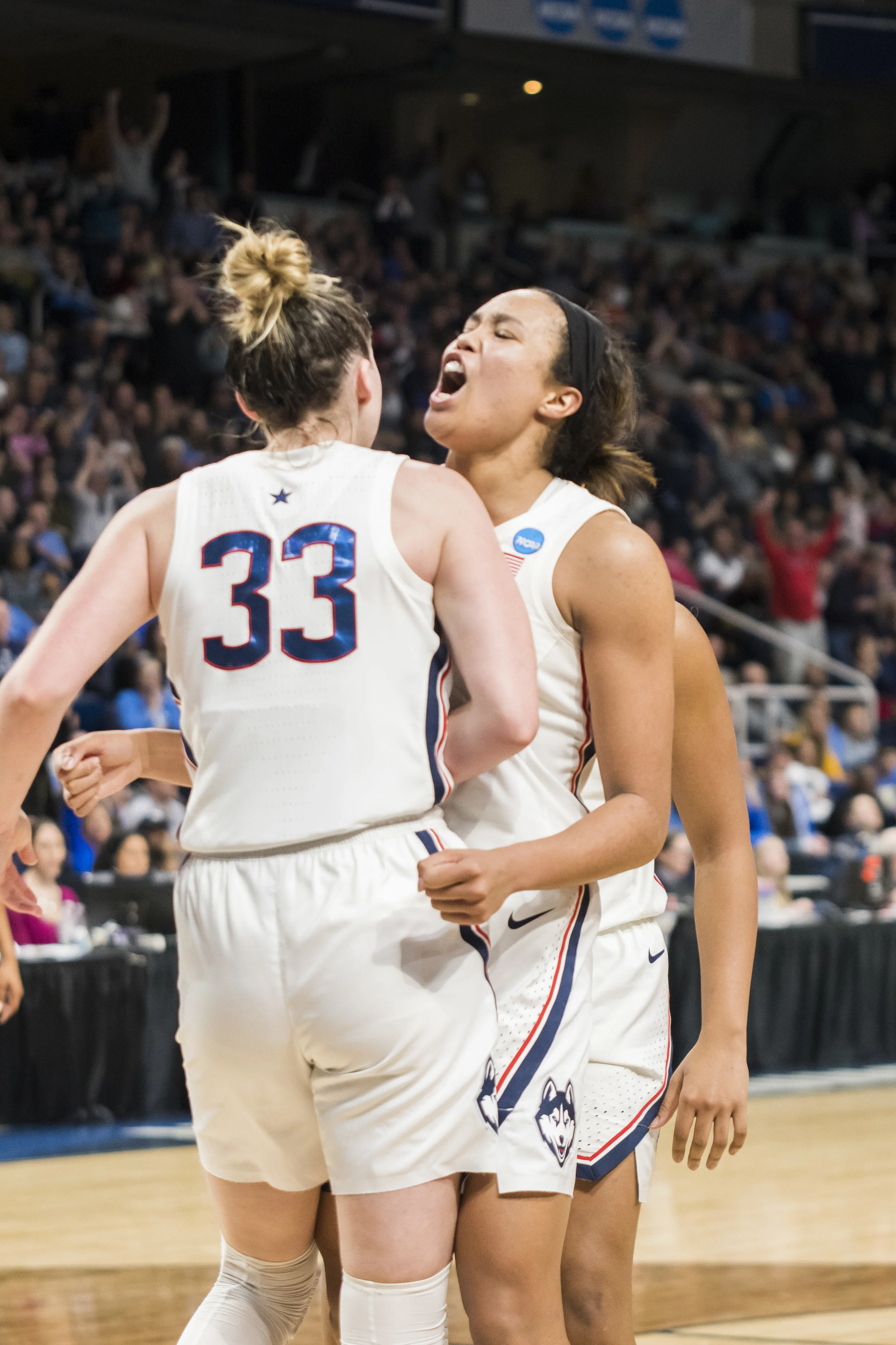 The Huskies continue their march down the tournament as they win against the UCLA Bruins 69-61 on Friday. Napheesa Collier (24), Crystal Dangerfield (5), and Christyn Williams (23) lead the game with 25, 15, and 14 points each. (Photo by Eric Wang/The Daily Campus)