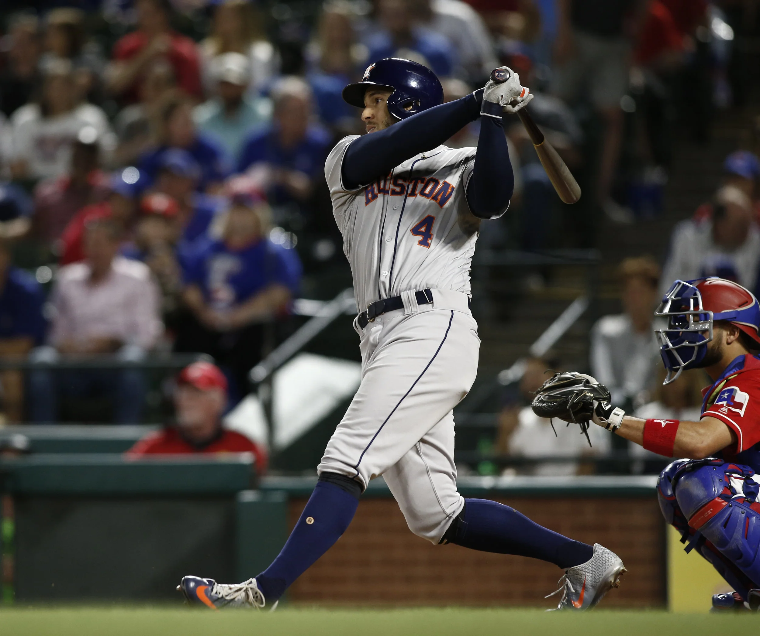 Houston Astros' George Springer (4) hits a two-run home run against the Texas Rangers during the seventh inning of a baseball game Saturday, April 20, 2019, in Arlington, Texas. (AP Photo/Mike Stone)