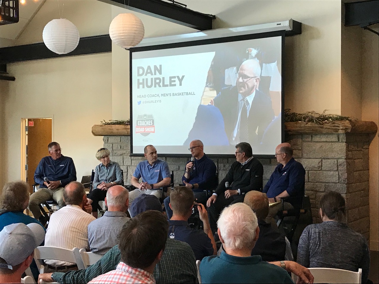 Head coach Dan Hurley speaks at the UConn Coaches Road Show in Mystic on Tuesday. Image by author .