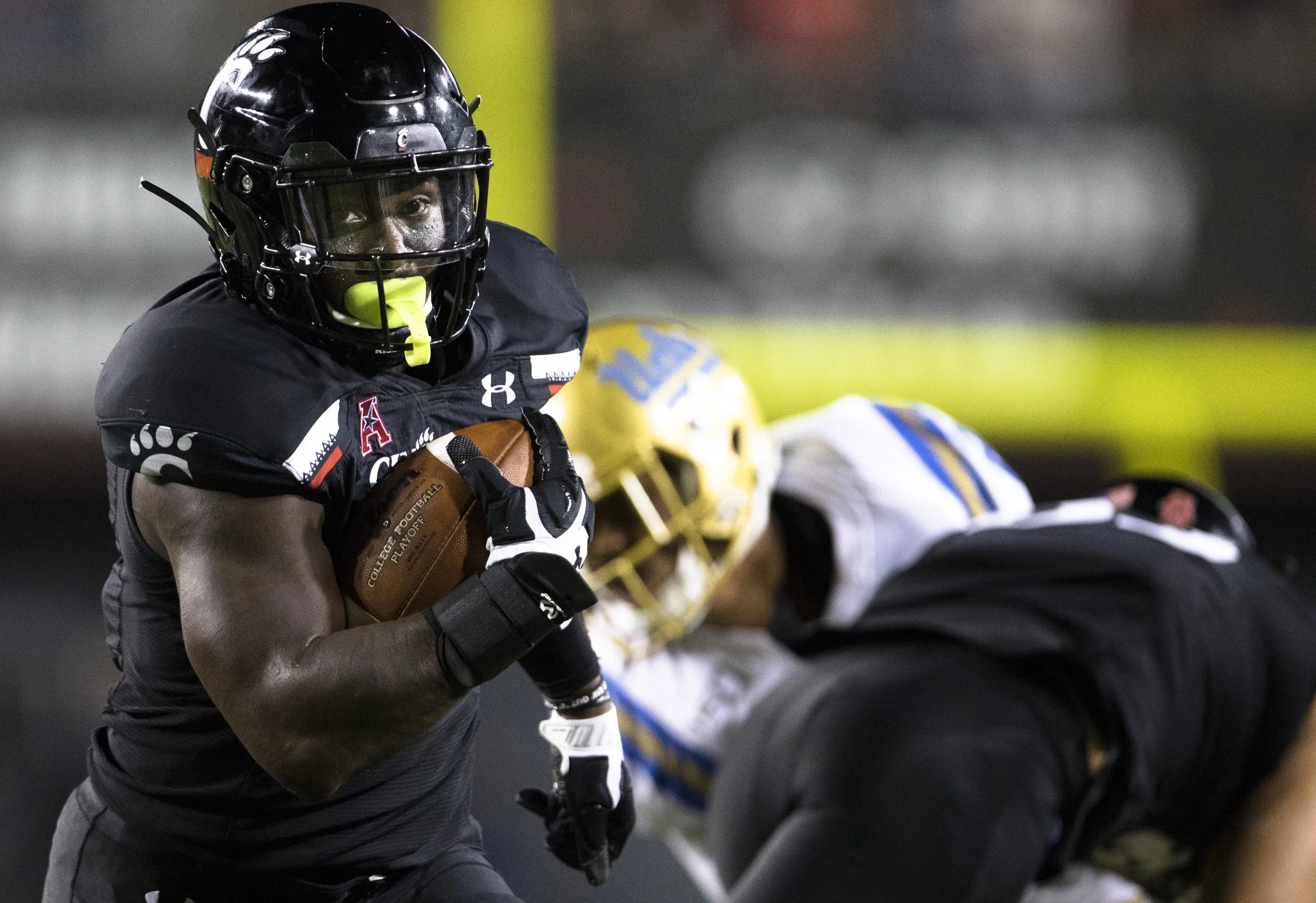 Cincinnati won their first game of the season against UCLA through their impressive play on the ground. Photo from The Associated Press
