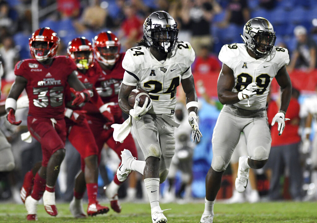 UCF running back Bentavious Thompson (24) breaks free for a touchdown against Florida Atlantic during the second half of an NCAA college football game. Photo by Jim Rassol/Associated Press