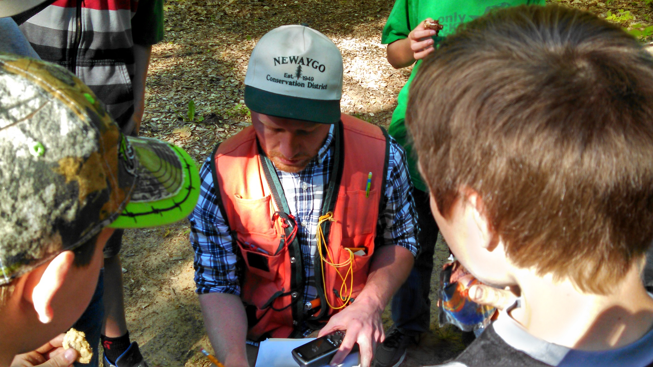 District Forester AJ Smith explains GPS systems to the Newaygo County Boy Scouts