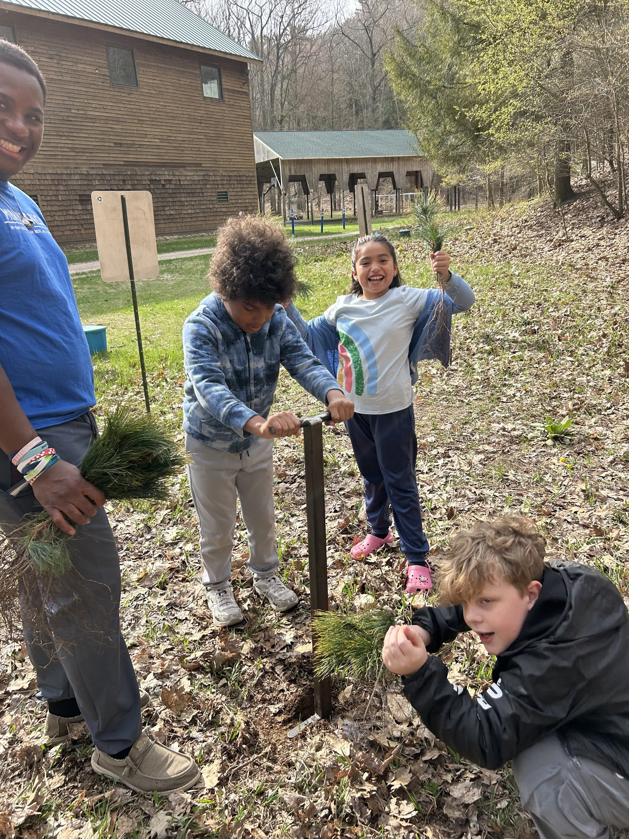Students Using Dibble Bars Planting