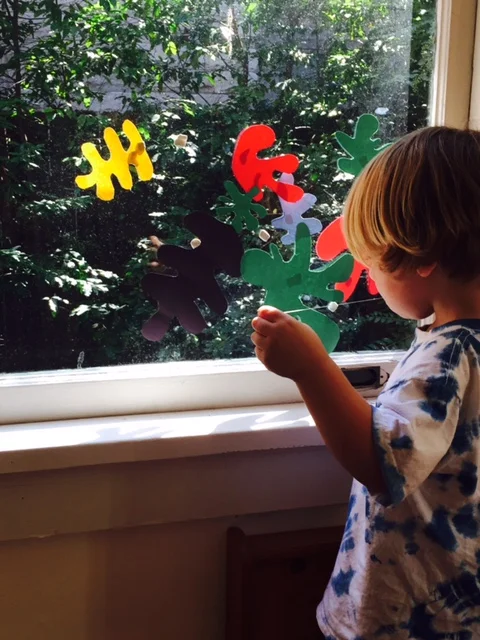 My three year old had fun sticking our cut outs to the window with poster putty.
