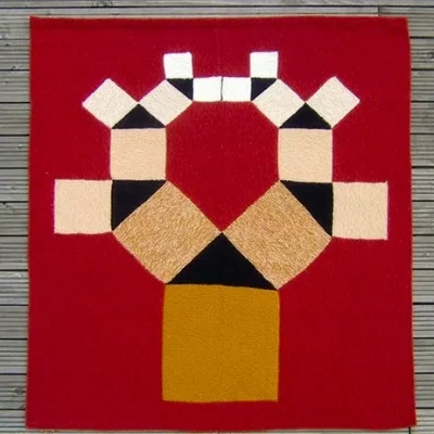 Pythagoras tree: an image based on Pythagoras’s theorem. For each black triangle you see the square on the hypotenuse and the squares on the other two sides. The Science Museum have the original. Photograph: Pat Ashforth.; My comment: Given the colors used, this one is evocative of african tribal art. 