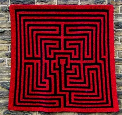 Amazement: a knitted maze. Photograph: Pat Ashforth; PERSONAL THOUGHT: THAT CENTER FORMATION MAKES ME THINK OF A KEITH Haring figure.