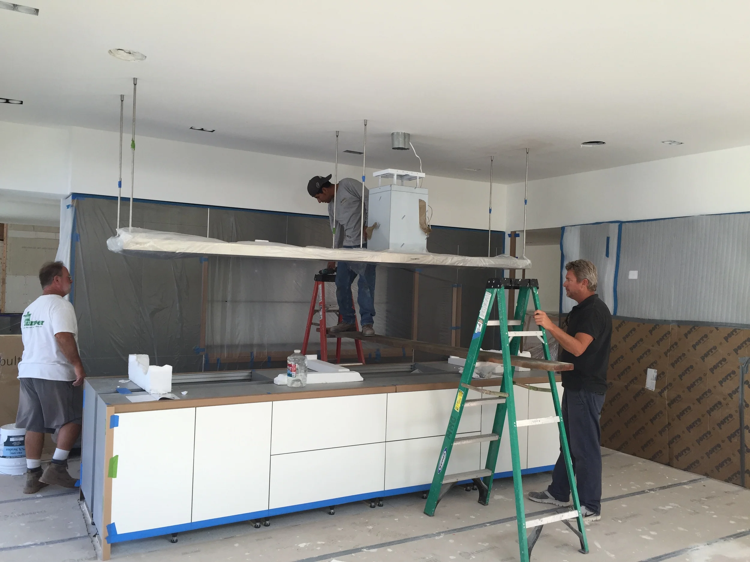 INSTALLATION OF AN 11' KITCHEN HOOD IN THE BULTHAUP KITCHEN.