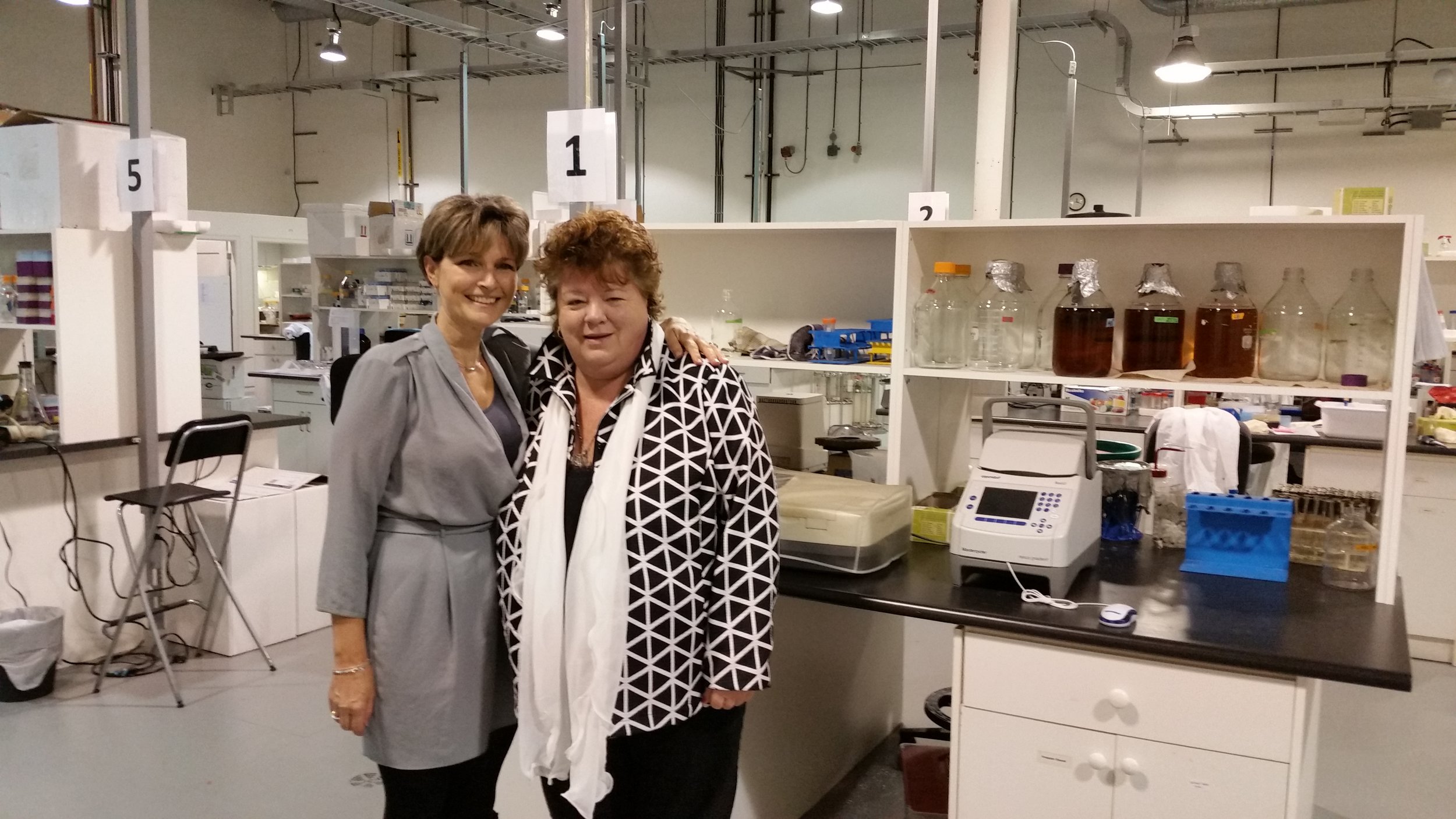 Pictured: The Hon. Linda Reid beside Dr. Sandra Dunn at the PhoenixMD Labs in Richmond.