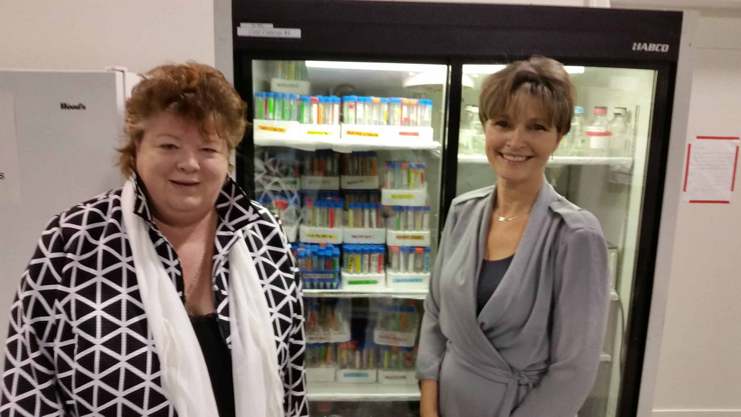 Pictured: The Hon. Linda Reid beside Dr. Sandra Dunn at the PhoenixMD Labs in Richmond.
