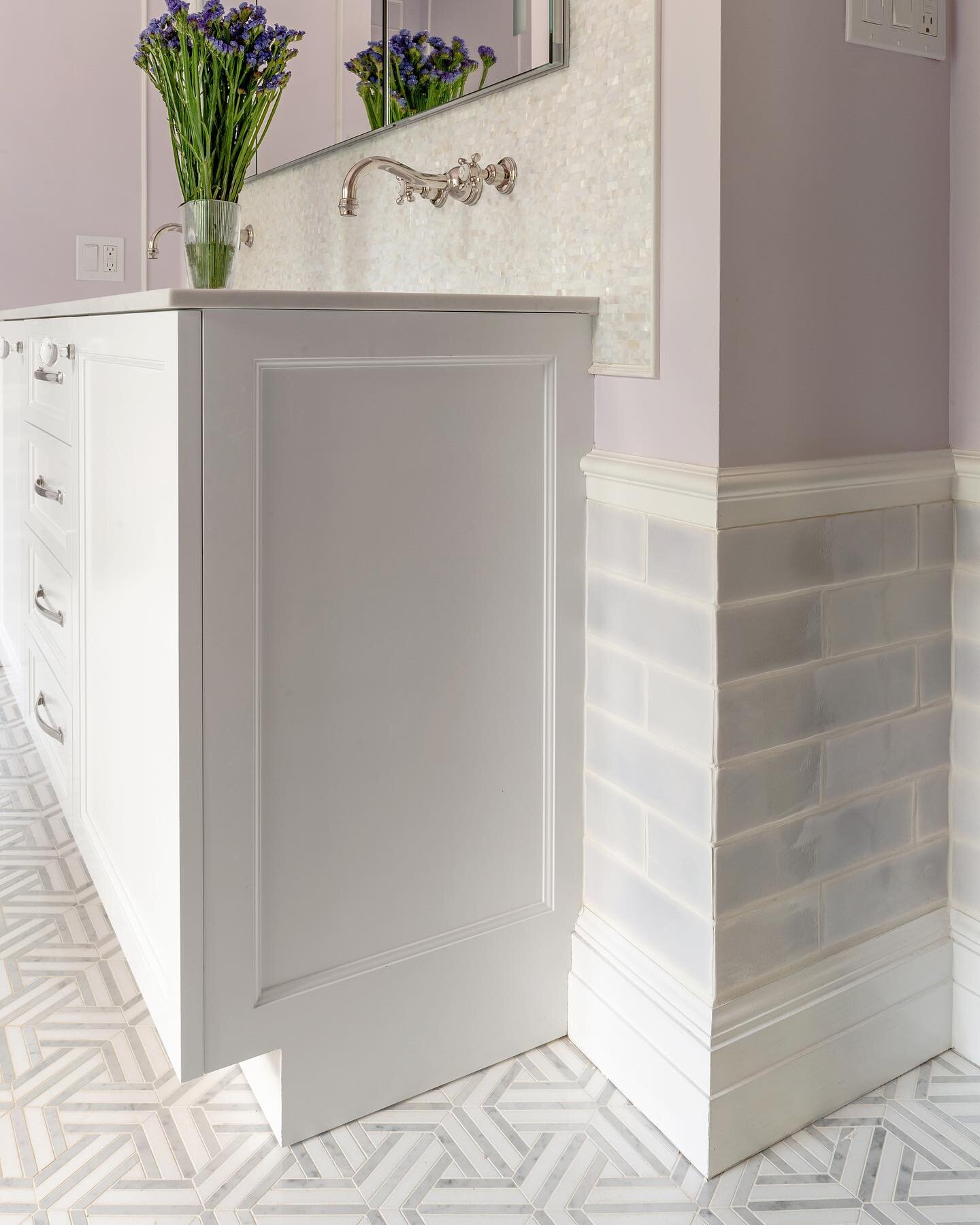 Four of the sweetest little girls share this custom bathroom that used to be a bedroom 🤍💜🤍💜our design includes soaking tub, stall shower, wc, laundry chute and this custom vanity. End panels work with large base mounding, that ties into chair rai