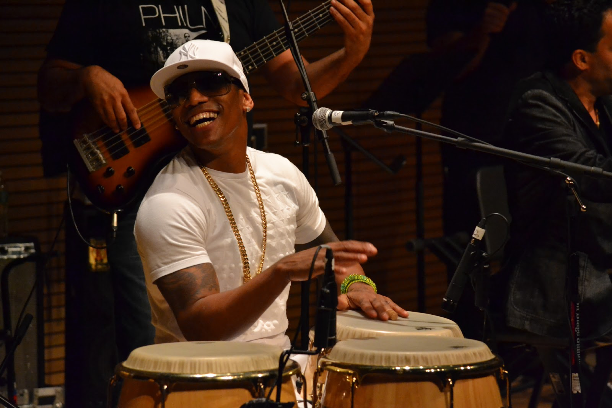 Pedrito Martinez smiling with fellow band members during the Day of Orula Celebration.