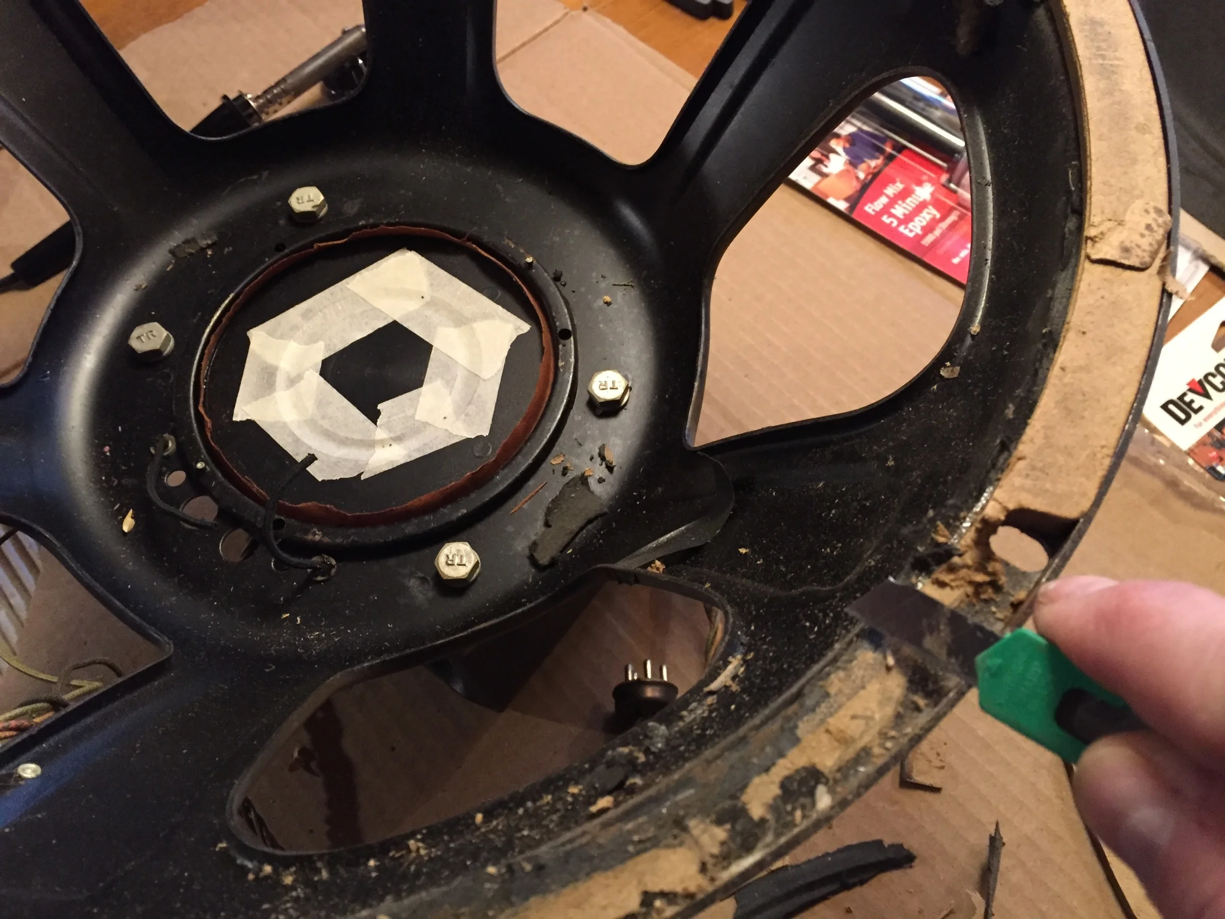 Removing the old gasket material.