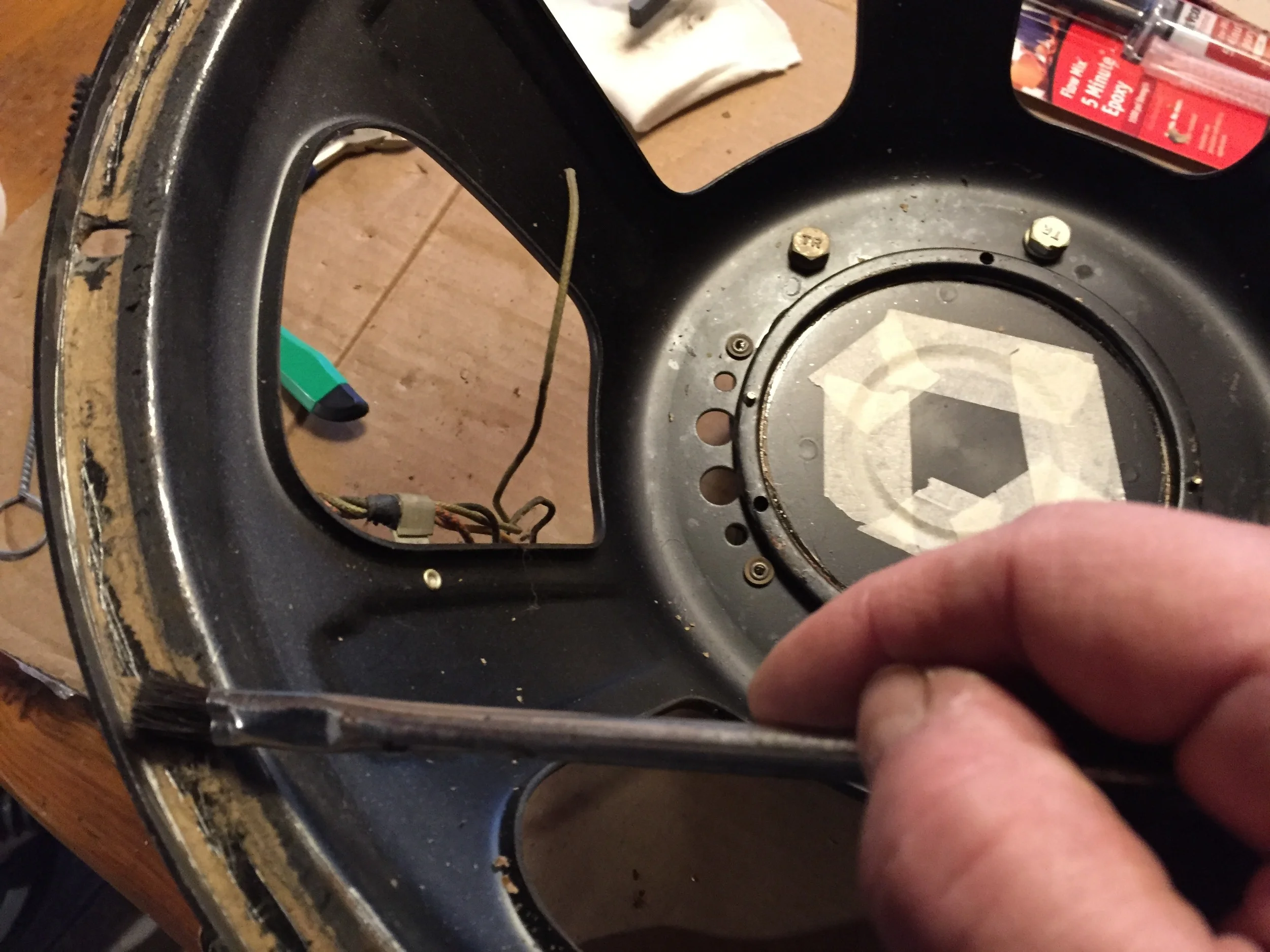 Applying new edge adhesive.